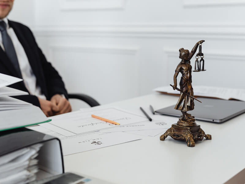 Lawyer's desk with justice statue.